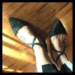 Glittery black flats with dainty stud accents